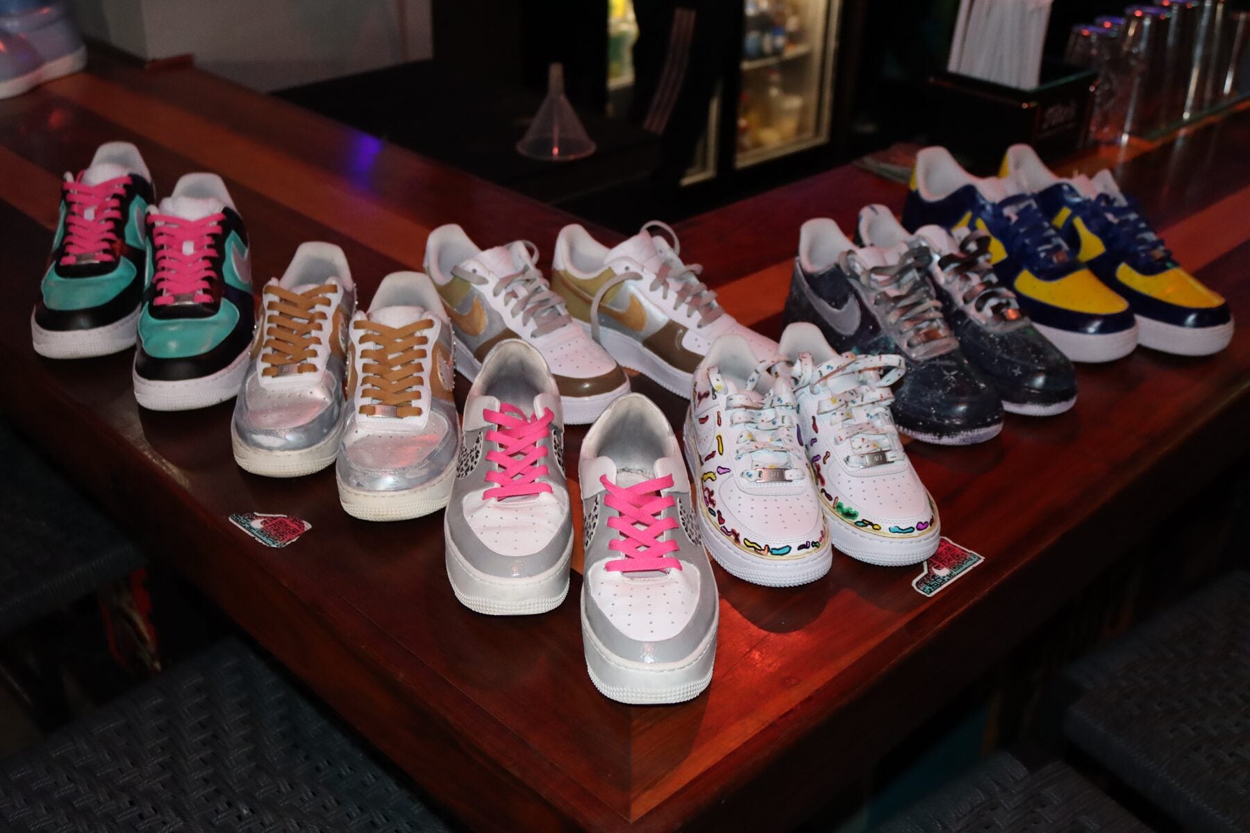 Collection of finished custom sneakers created during a Kick Art group workshop in Miami