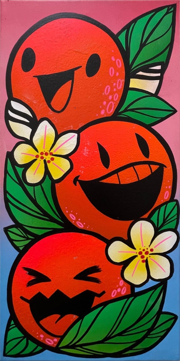 Three expressive oranges among green leaves and white tropical flowers on a pink and blue background.