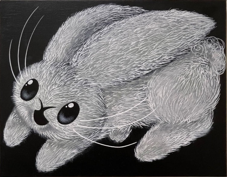 Fine white and gray strokes trace a wide-eyed rabbit across a deep black background.