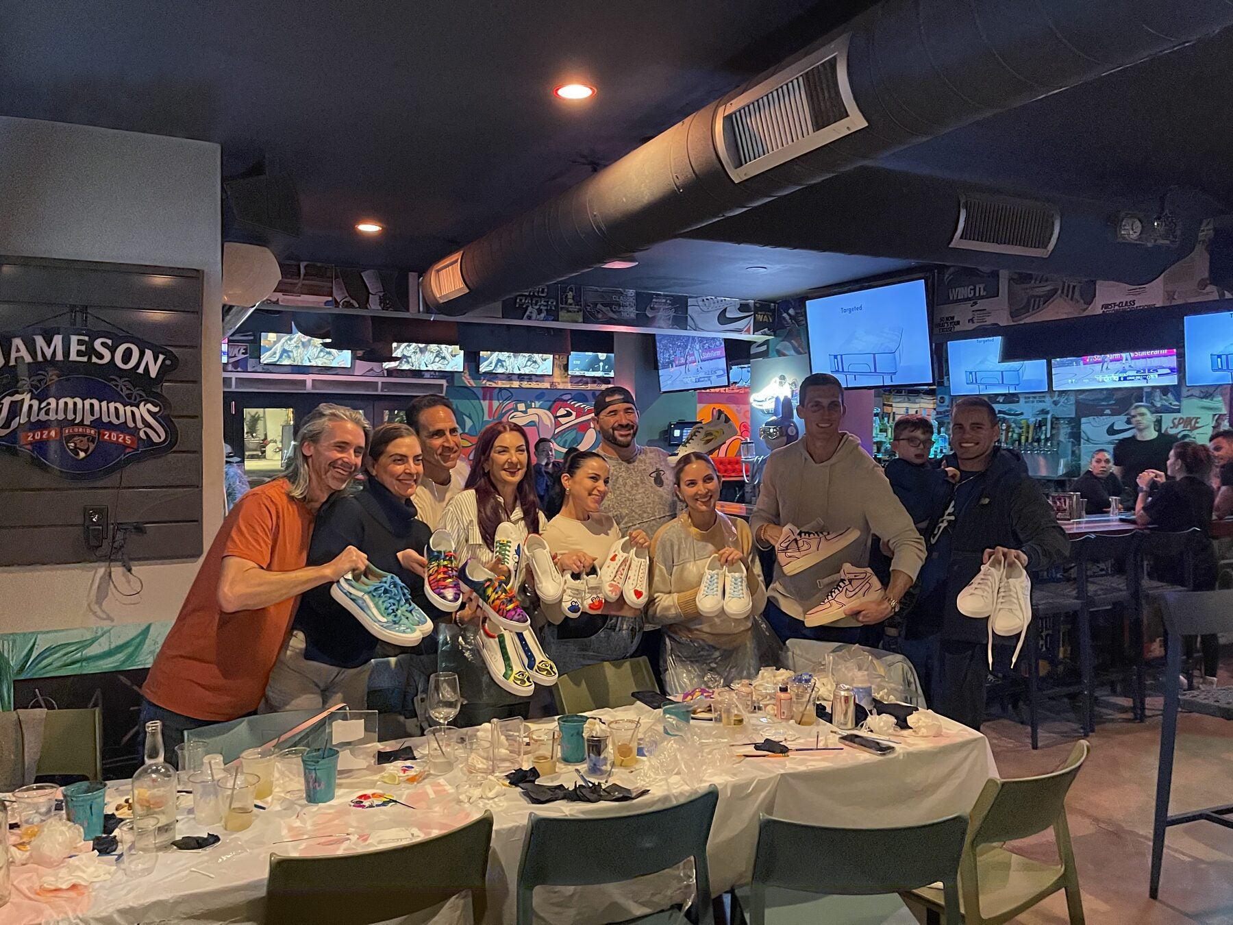 Private group celebrating after a custom sneaker party at Grails in Wynwood