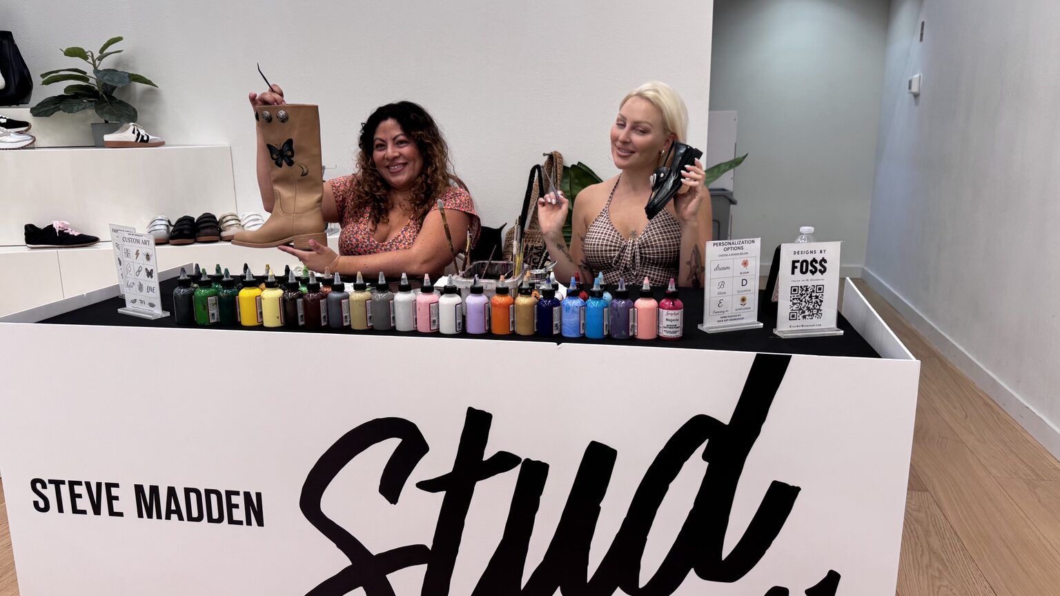 Steve Madden guests participating in a live footwear customization brand activation by Kick Art